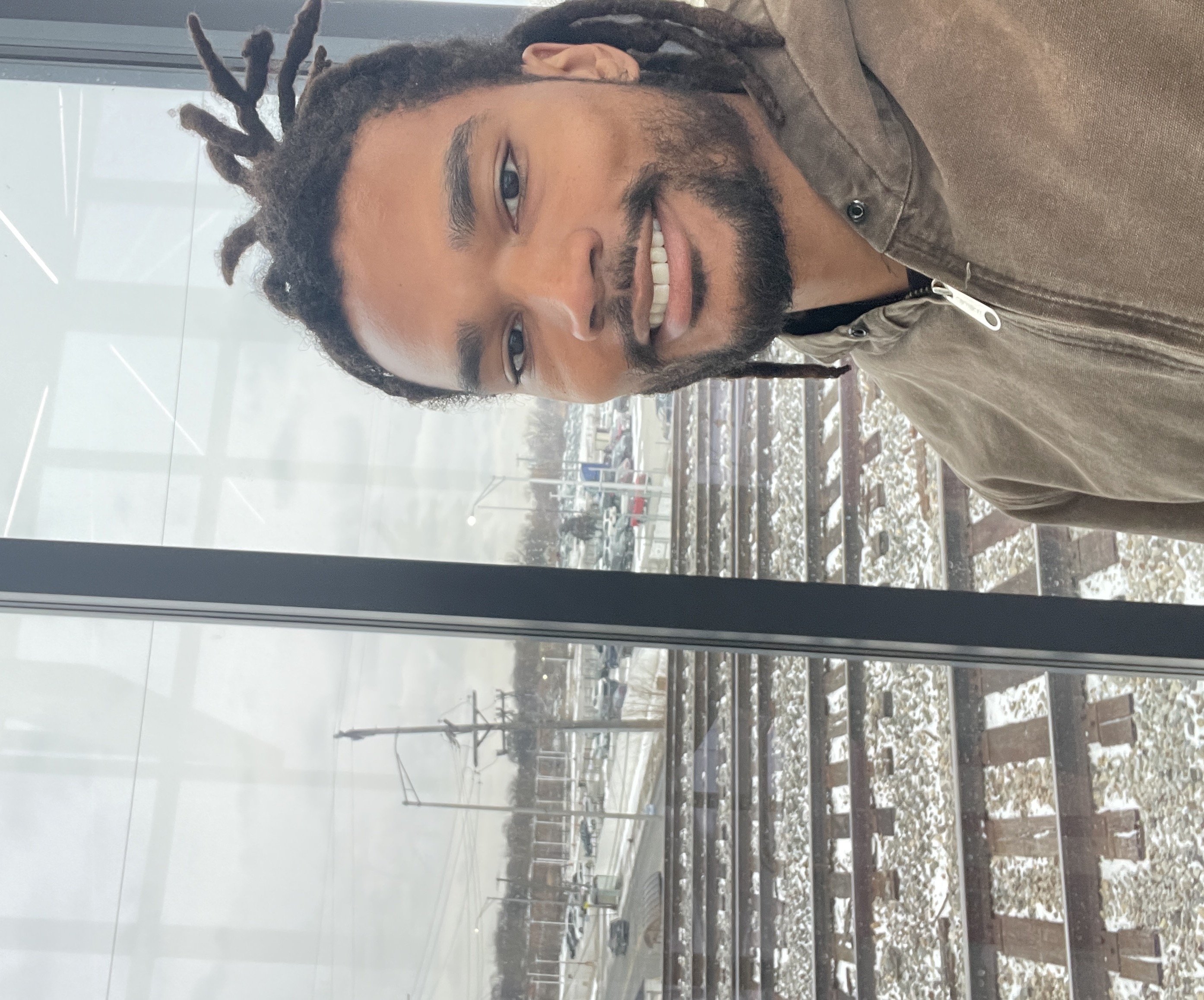 Lance by the window over the rail tracks